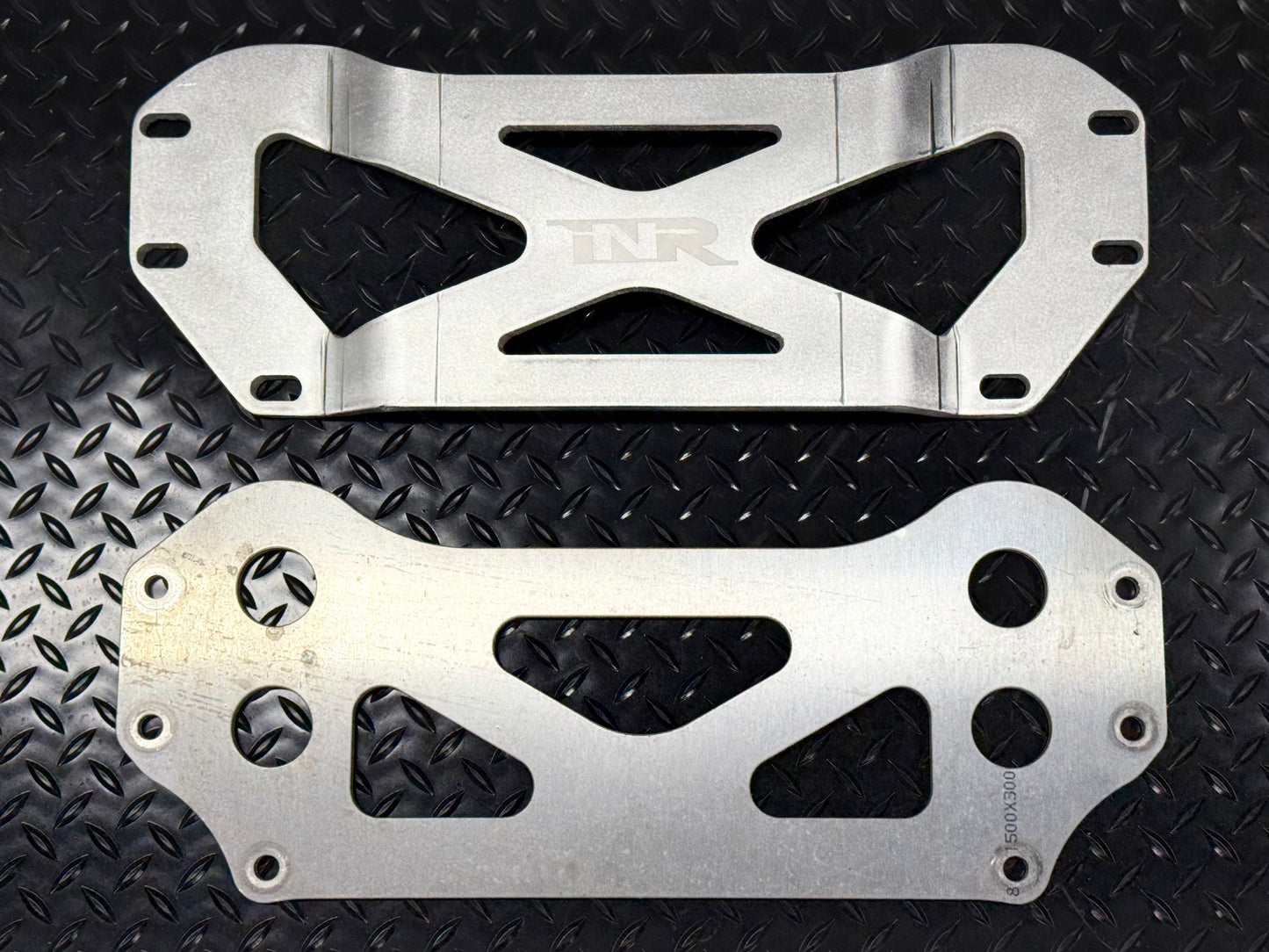 INR drop brace (top) beside the factory brace