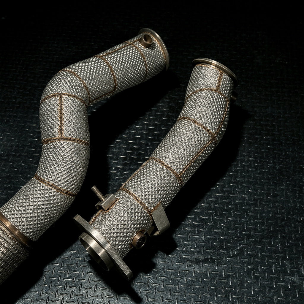 Heat-wrapped S58 downpipes standing upright