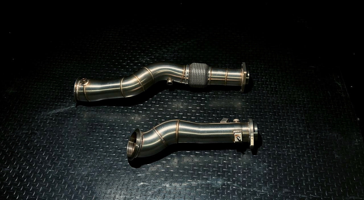 Bare stainless S58 downpipe, side profile