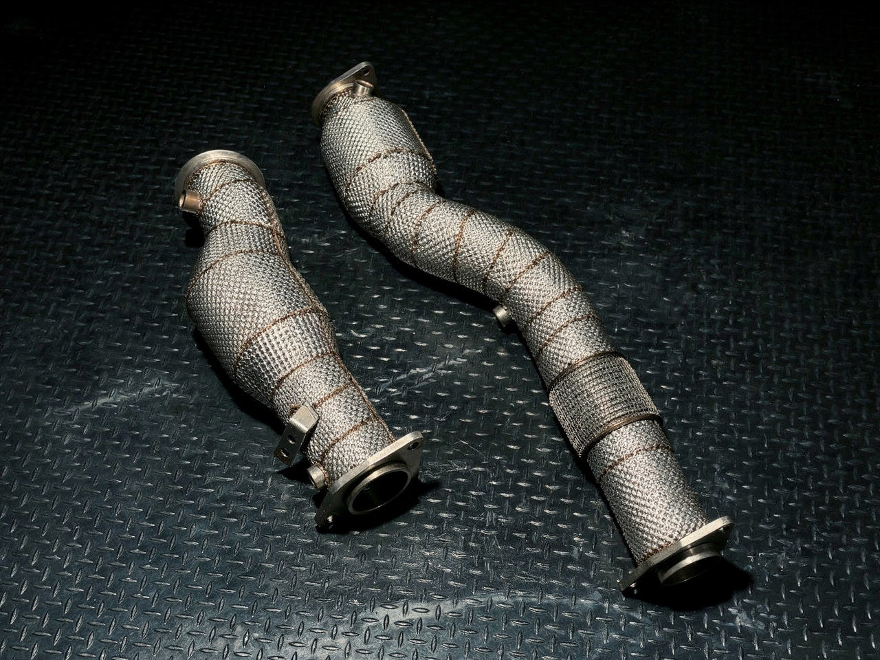 Pair of heat-wrapped S58 downpipes, angled view