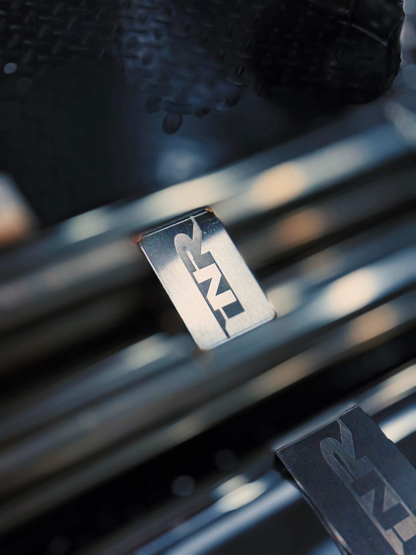INR badge detail on the polished MACH-1 mid-section